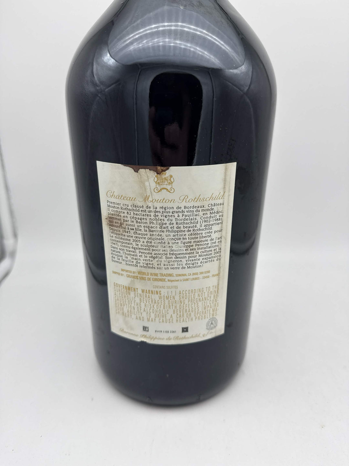 Château Mouton Rothschild 2005 3L bottle, torn stained back label, white background